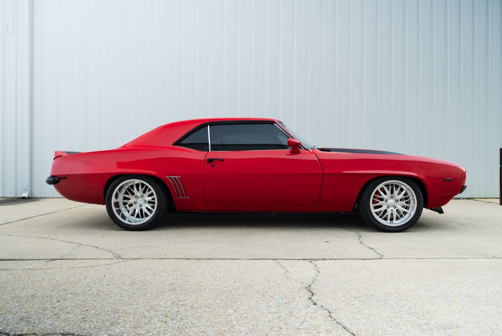 1969 Chevrolet Camaro in red with black stripes, built by Morgan Muscle Cars