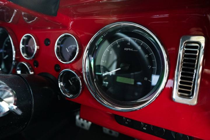 Chrome-bezel gauges in the red dash of the 1969 Camaro