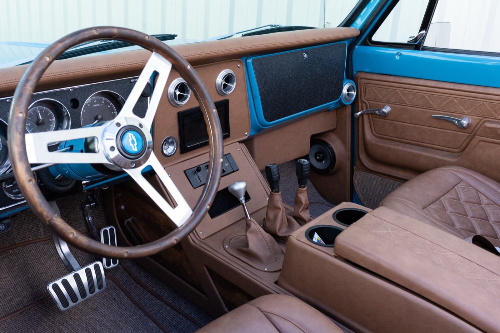 Custom interior, steering wheel, and center console in the light blue 1972 K5 Blazer