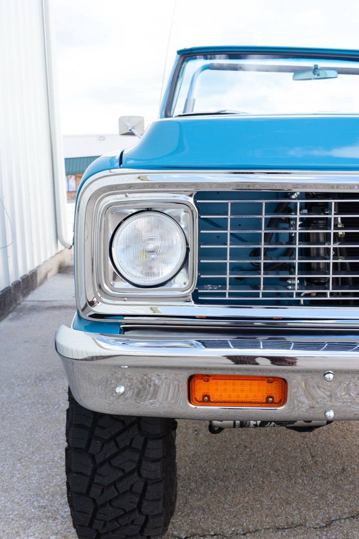 Headlight and grille on the light blue 1972 K5 Blazer