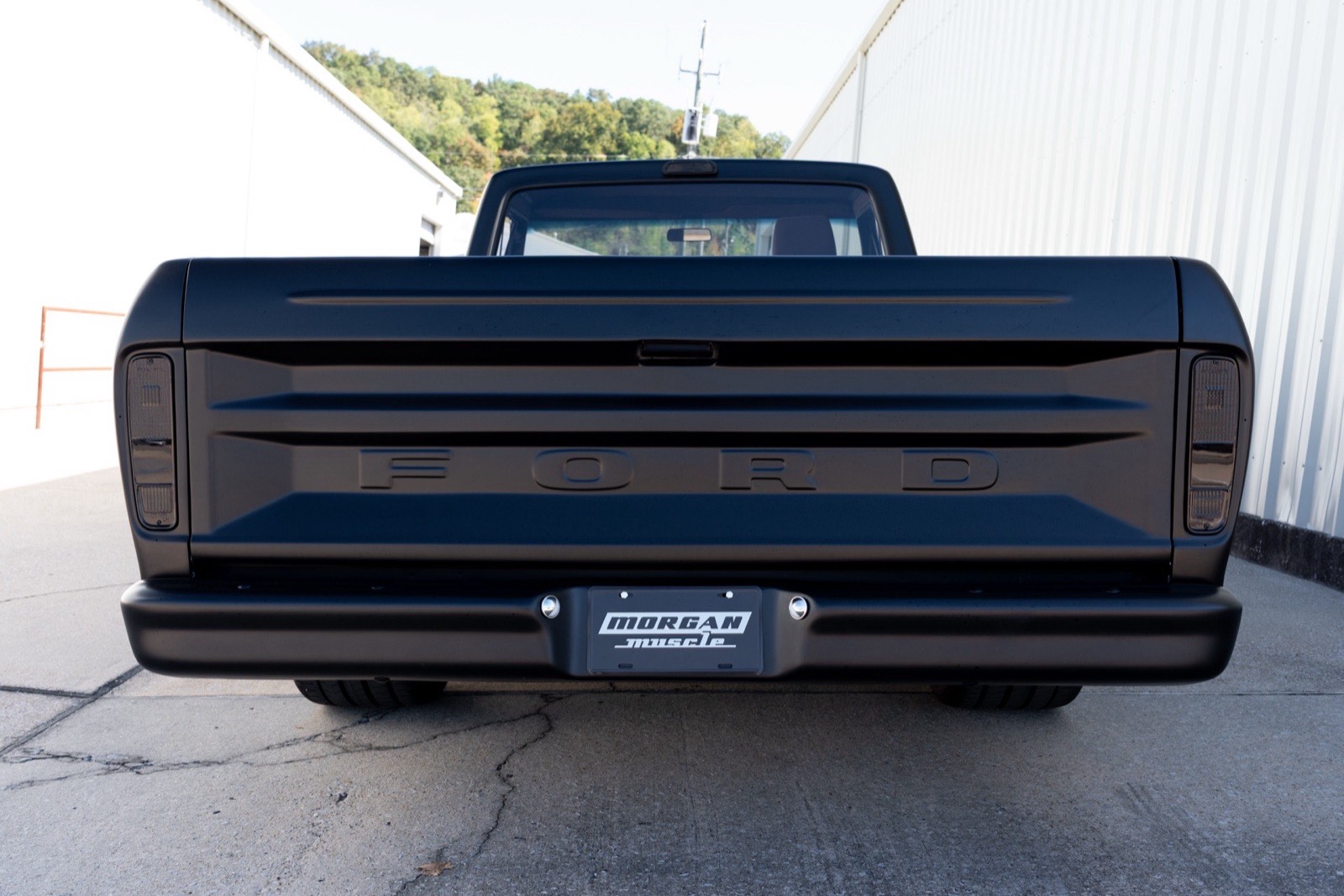 Rear of the satin black 1973 Ford F-100