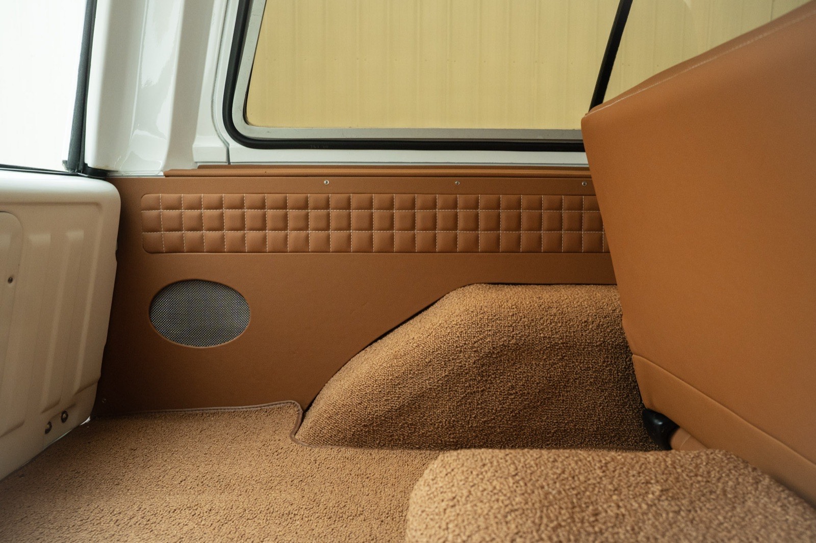Tan carpet and custom side panels in the cargo area of the 1984 K5 Blazer
